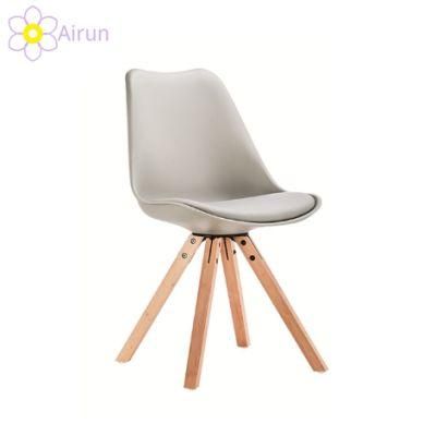 Free Sample Cheap Dining Room Furniture PU Leather Soft Cushion Plastic Chair Modern Design Wooden Legs Dining Chair