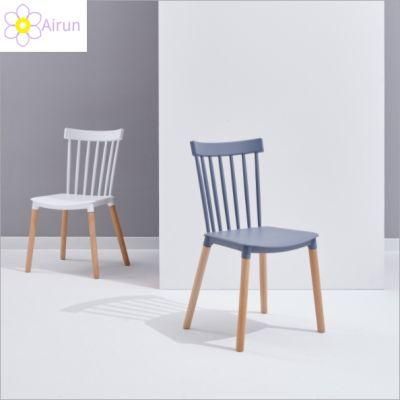 Wholesale Home Furniture Cheap Modern Dinning Chair Design Plastic Windsor Chair with Wood Legs