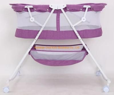 Compact Baby Bed with Canopy and Rocking Function