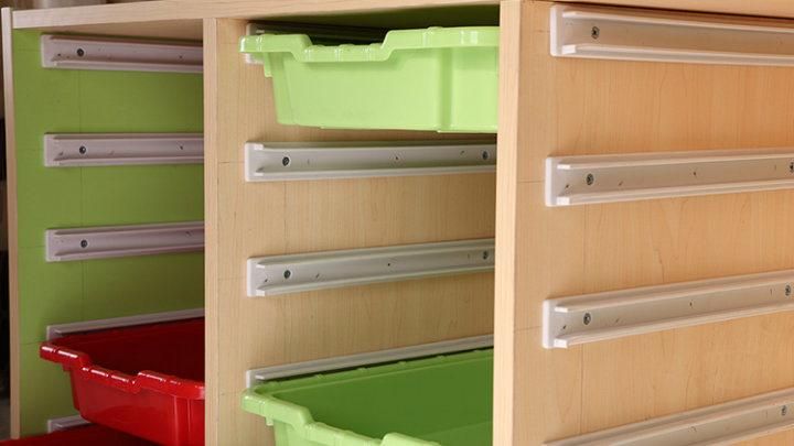 Children Studying Shelves of Kids Furniture with Plastic Storage
